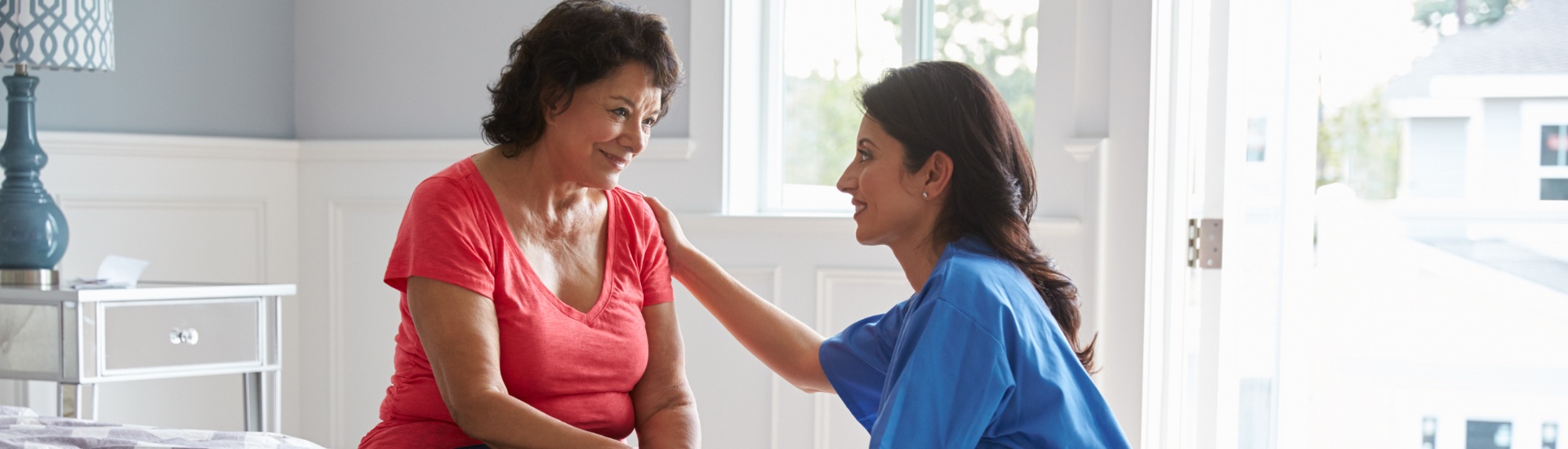 National Nursing and Rehab nurse making home visit to senior woman